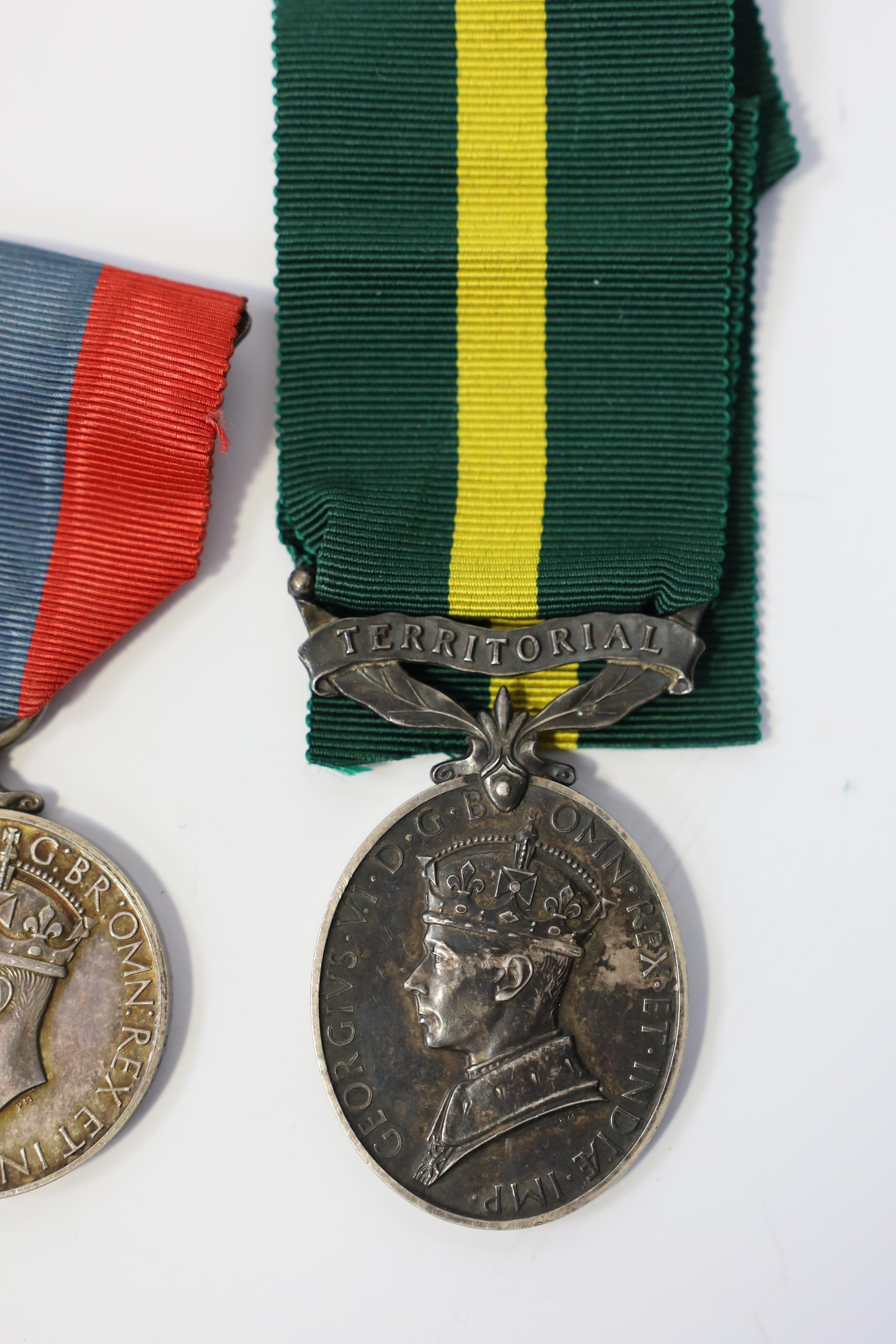 Three assorted service medals; Ed VII Volunteer Officer's Decoration hallmarked for 1905; GV Imperial Service medal to Walter Charles Cornish; GVI Territorial Efficiency medal to 2062789 . S/Sgt. L.W.Sergeant. R.A. Condi